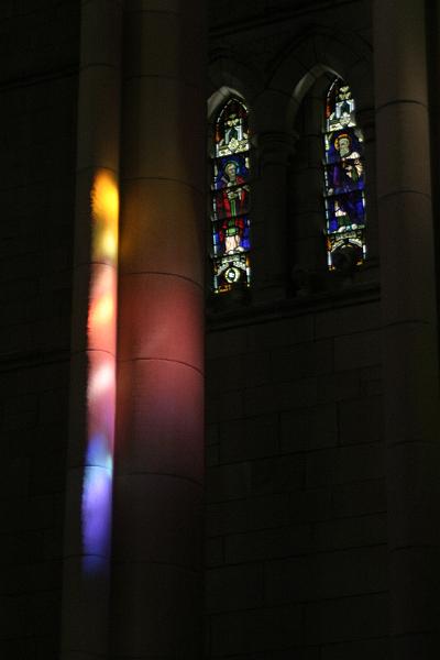 IMG_3026.JPG - The stained glass paints beautiful colours on the columns and floor.